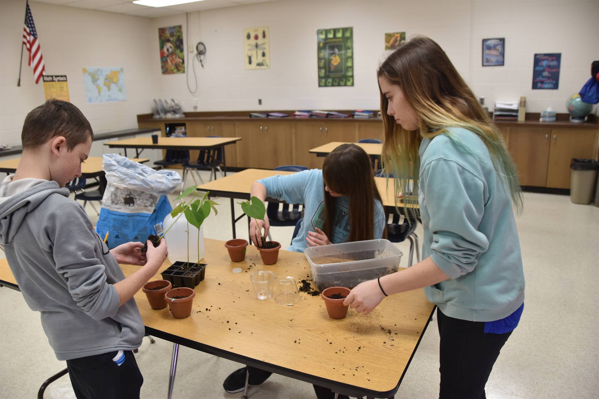 students potting plants