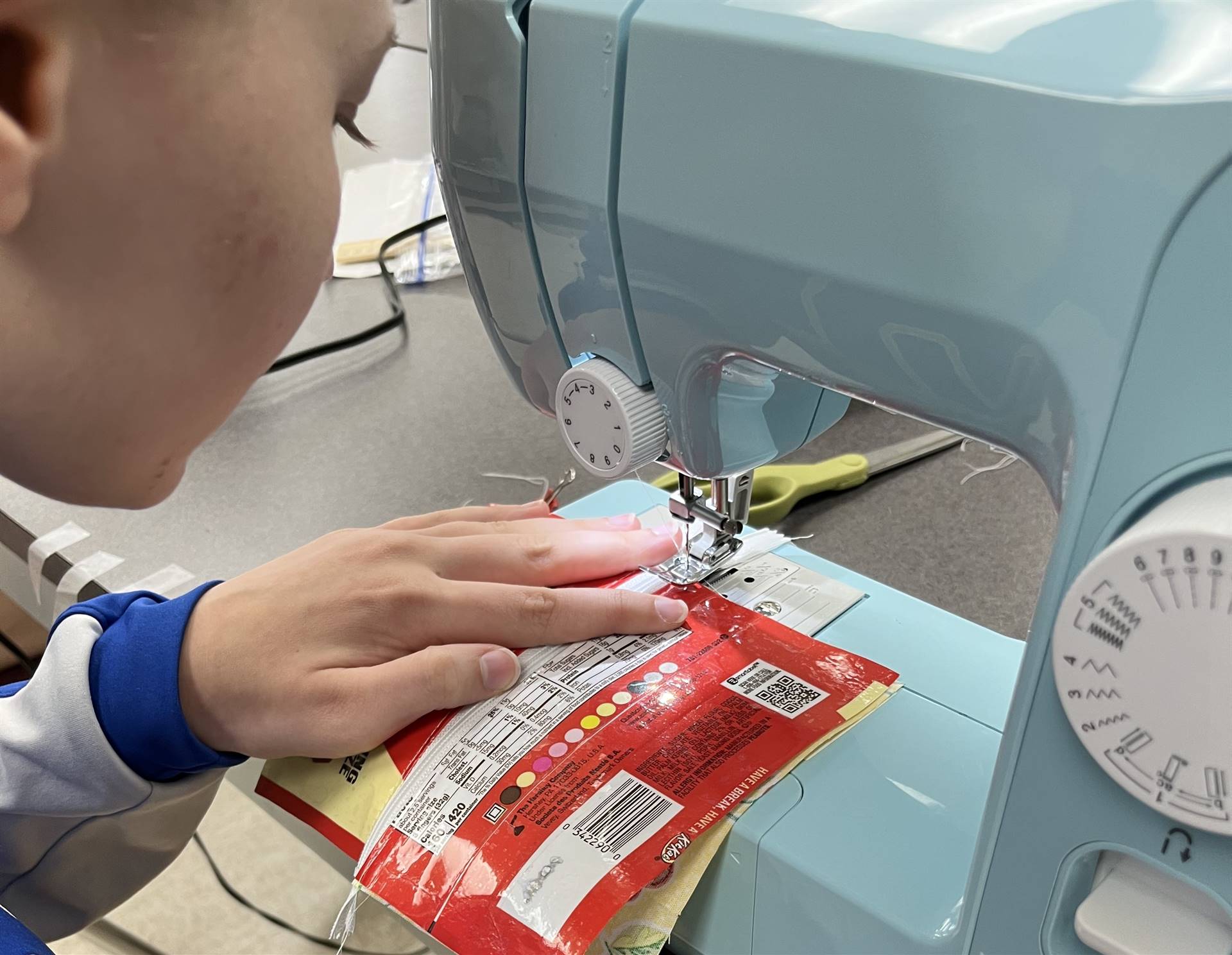 student sewing